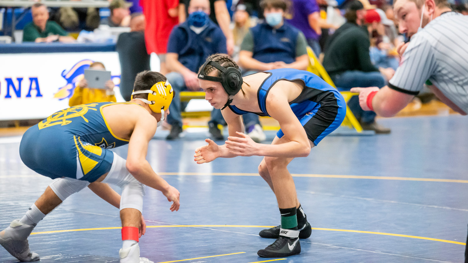 Adna’s Kolton Moon wrestles Xavier Smith from Ilwaco during a match Saturday afternoon in Adna.